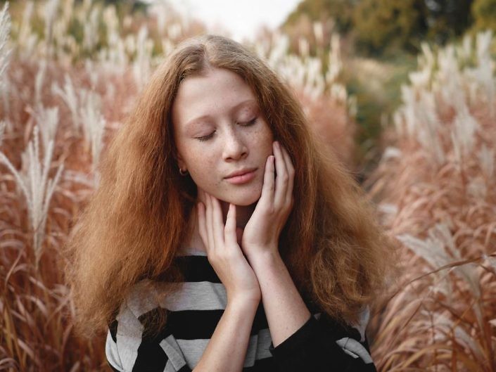 Tender girl feels freedom on the autumn field